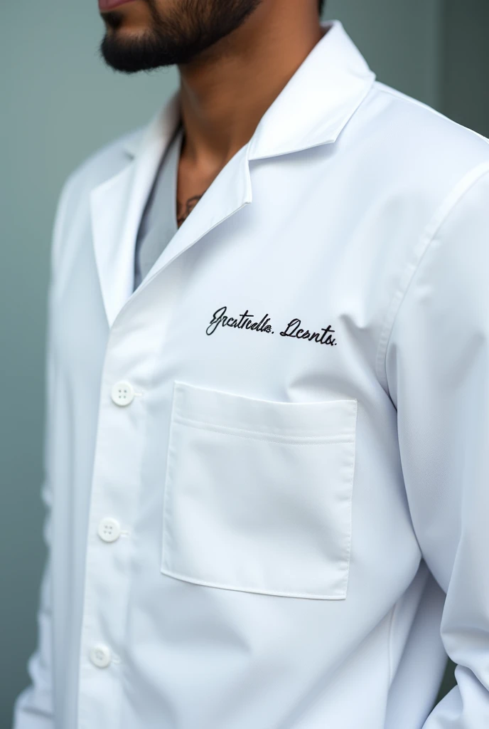 I need you to create a white dentist coat with the phrase embroidered on it: "wear. PRIMOLA"