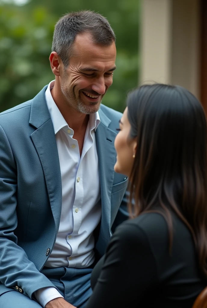 Realistic close up scene of a single 40 year old man, Without beard, white black short haired caucasian, Without beard, barefoot western, standing, wearing a light blue suit, pants and a doctor or monk style jacket Spiritual, with a relaxed attitude and a slight smile. no beard. In a spiritual environment, interacting with a white western woman with long black hair, what is medium, wearing black clothes. The man is next to the woman and the woman is sitting.