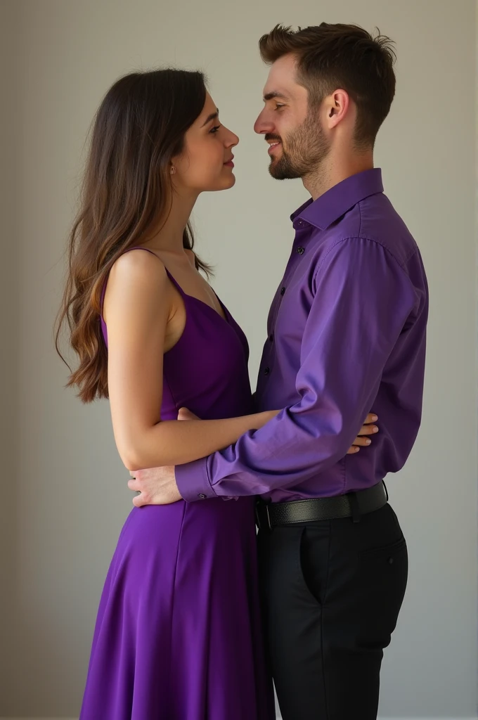A young man holding a young woman by the waist, she in a purple dress and he in a purple shirt and black pants.
Let them look into each other's eyes