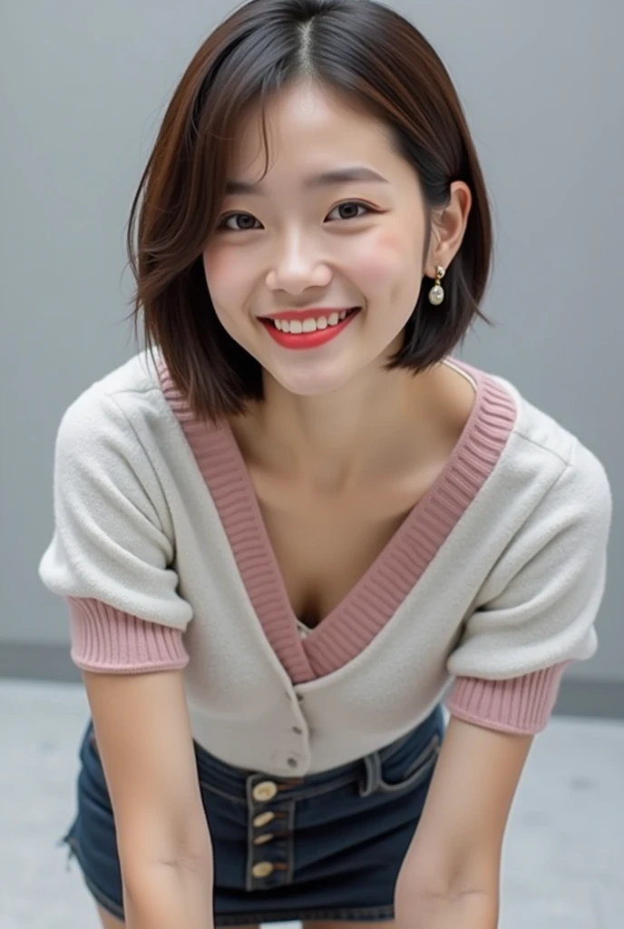 ((Highest quality, 8k, Portraiture: 1.3)), (Viewer Display), Photographic realism, Sharp focus, alone, A very beautiful Japanese office lady、Denim mini skirt、( pink open loose v-neck sweater)、open clothing white bra、evil grin、smiling at viewer、short hair、Gray background、Leaning forward、Front Light、Bend your body,front,top-down view、down blouse, ((Cleavage)),