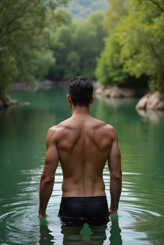 A white man, at 3, model type, with short dark hair, with clear eyes, wearing a full shirt and boxers, standing backwards, looking at the camera and showing her ass in a lake in Alentejo