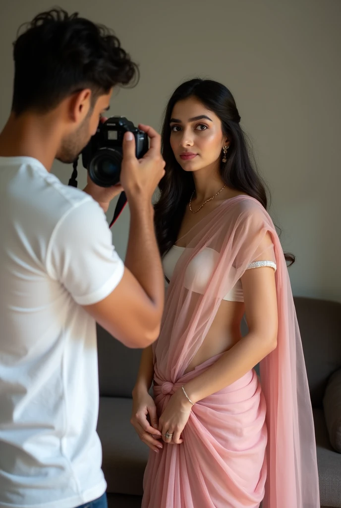 One 3 indian woman wears pink colour transparent saree and blouse, looking at camera and standing infront of a 2 indian handsome boy wears white tshirt who holds  camera in hand and clicking her photos, in their house.