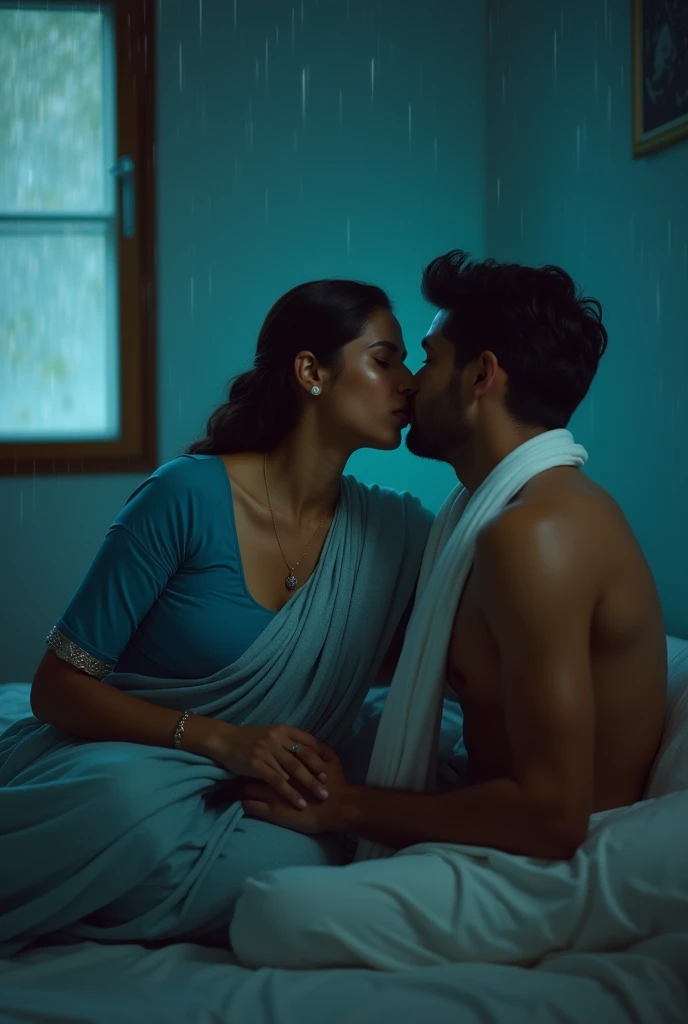 photo of Voluptuous Mature Indian Aunty with dusky skin, wearing tight Sky blue Kurti and White stole around her throat, showing her large U cut Cleavage, Hair Tied behind,Sitting on bed turning her head and Kissing a Shirtless Slim Young boy, Dim Night light in the room, Rain pouring outside window.
