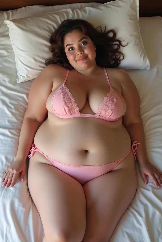 cute chubby girl on a bed in pink bikini, bug bust, almost nipple out