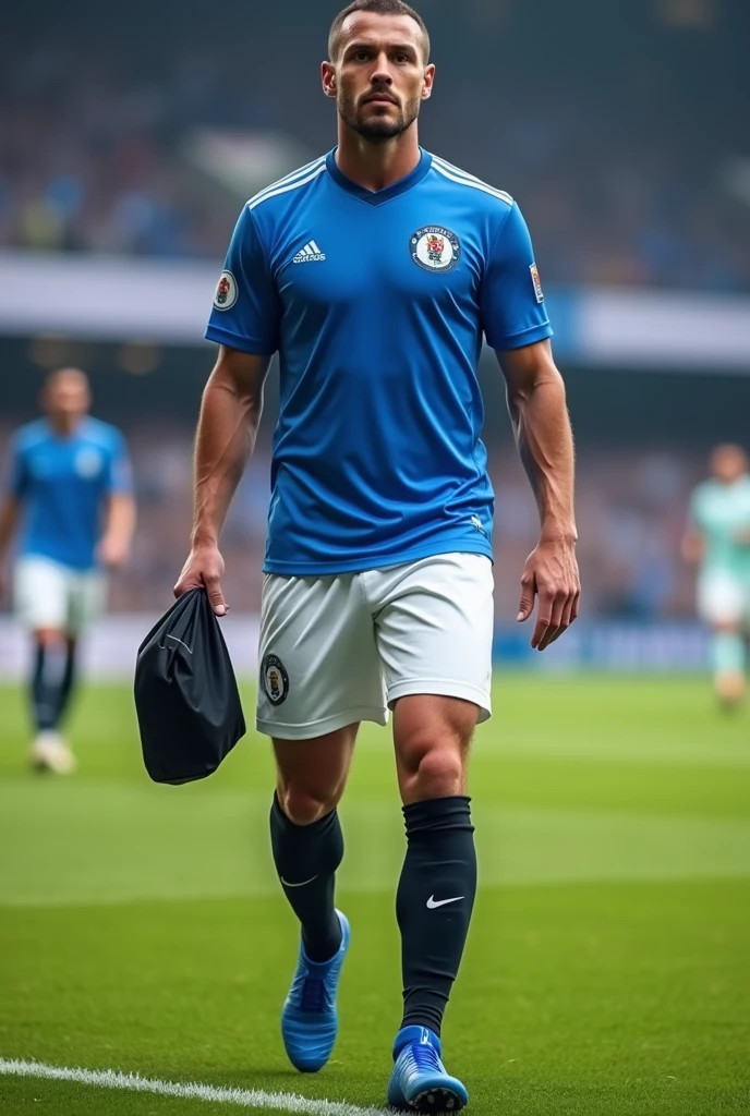 A man wearing a blue jersey and a white shorts and wearing a black skins in his hand and a black sockins in his leg and wearing a blue football boot in his foot