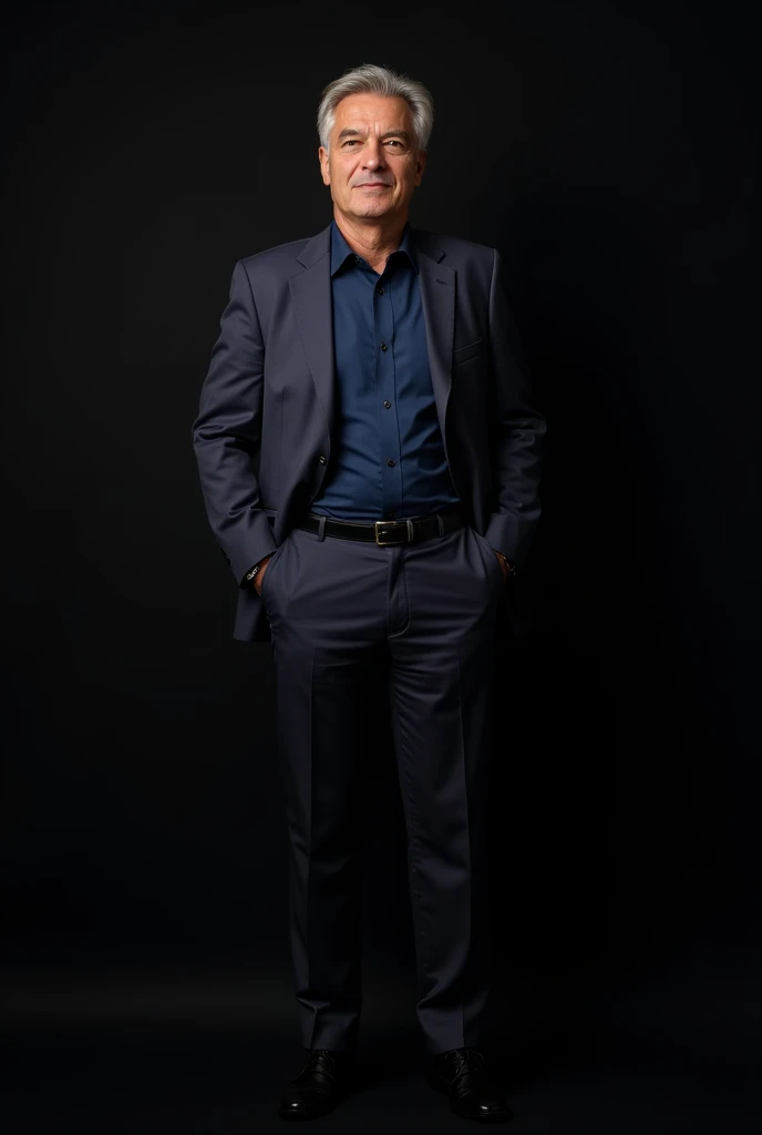 Man standing in front of black suit and navy blue dress shirt
