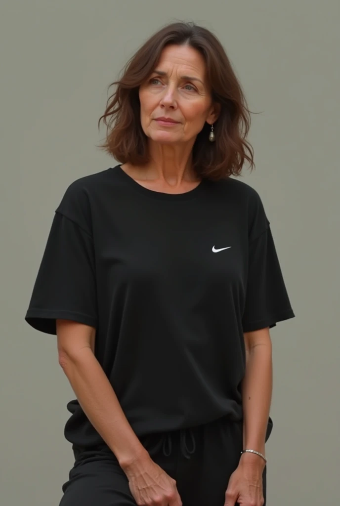 Middle age girl with wavy hair, black nike shirt, light black pants barefoot