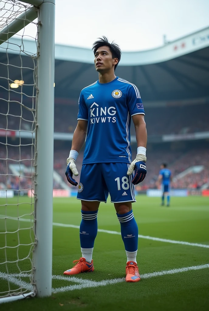 Young Japanese man in leceister city goalkeeper uniform in goal 