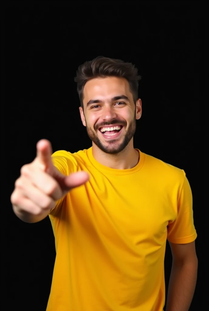 A man with a big smile on his face. He is wearing a yellow t-shirt and is pointing his finger towards right side. The background is black.