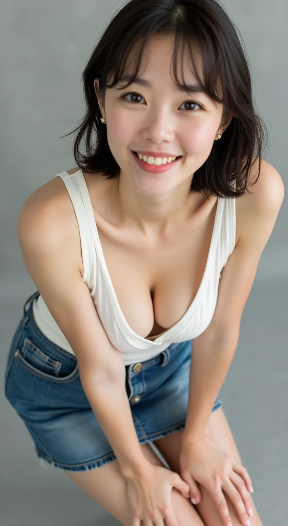 ((Highest quality, 8k, Portraiture: 1.3)), (Viewer Display), Photographic realism, Sharp focus, alone, A very beautiful Japanese office lady、Denim mini skirt、 (Tank top)、oversized clothes,White bra、evil grin、smiling at viewer、short hair、Gray background、Leaning forward、Front Light、Bend your body,front,top-down view、down blouse, ((Cleavage)), low angle