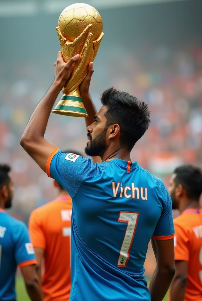 A man who is standing with football World Cup in india with Indian football jersey name vichu