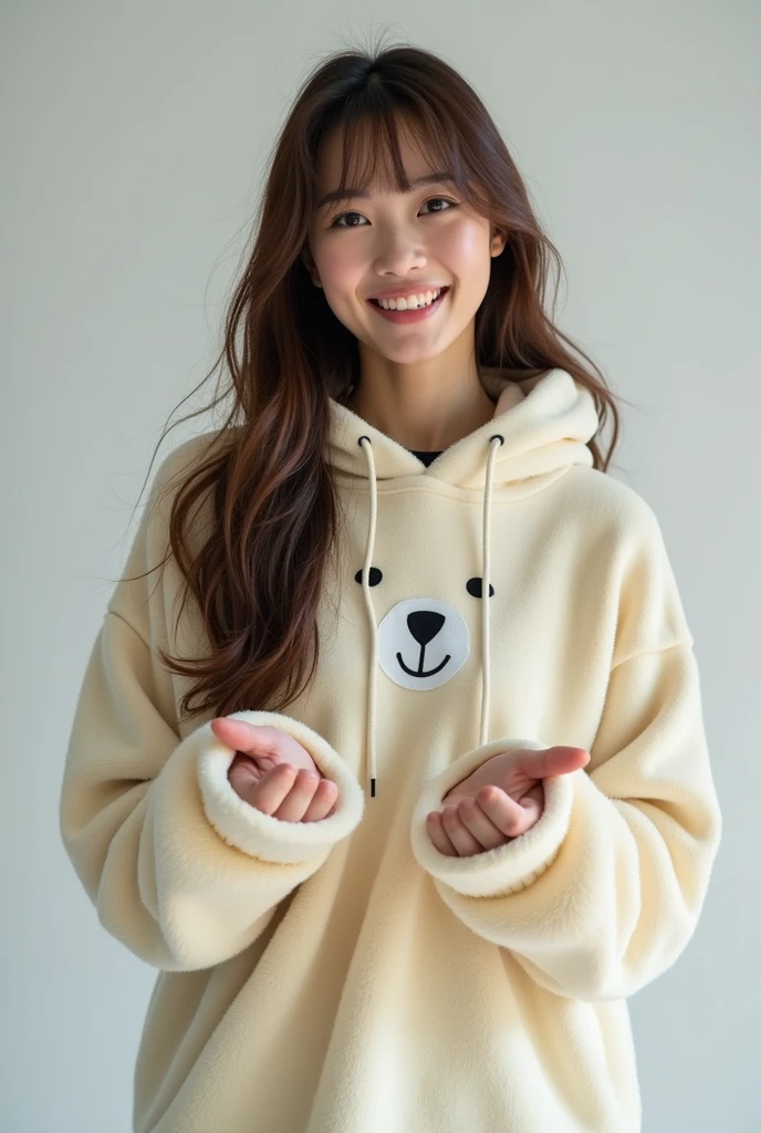 A 20-year-old female broadcaster with long brown hair and bangs wearing a polar bear hoodie