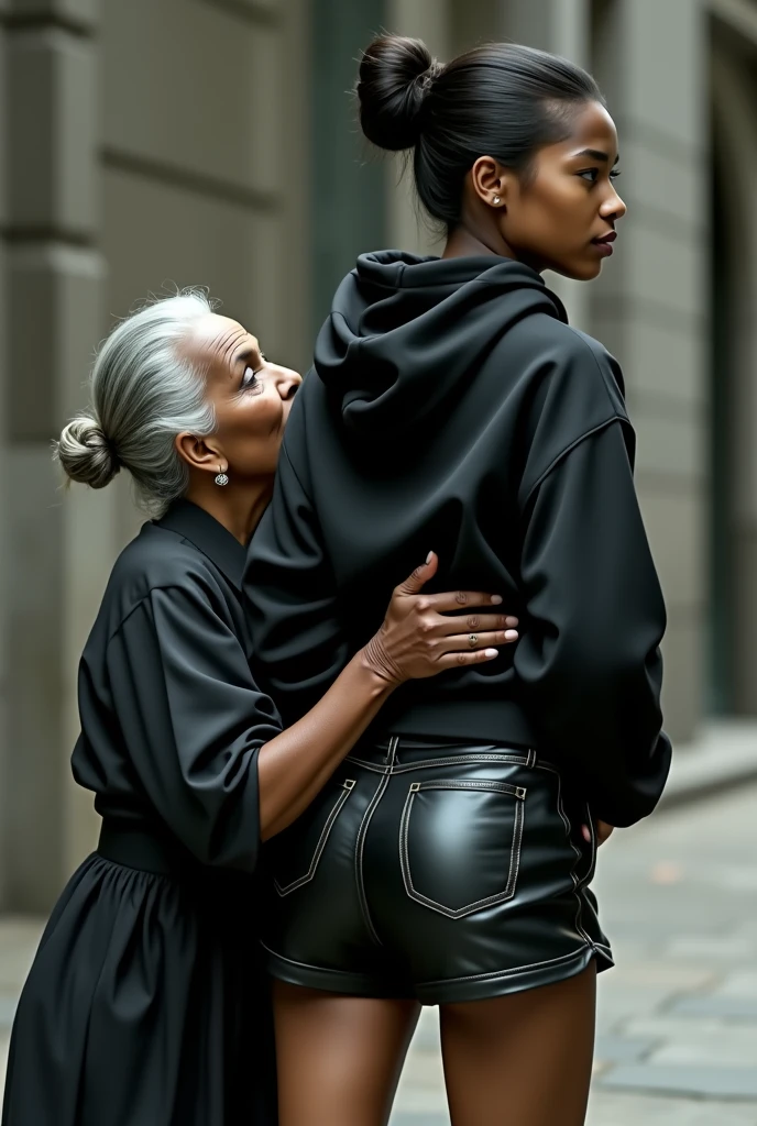 black woman hair in a bun black hoodie black leather short shorts a old grandma in a dress on her knees kissing her ass behind her squeezing her butt