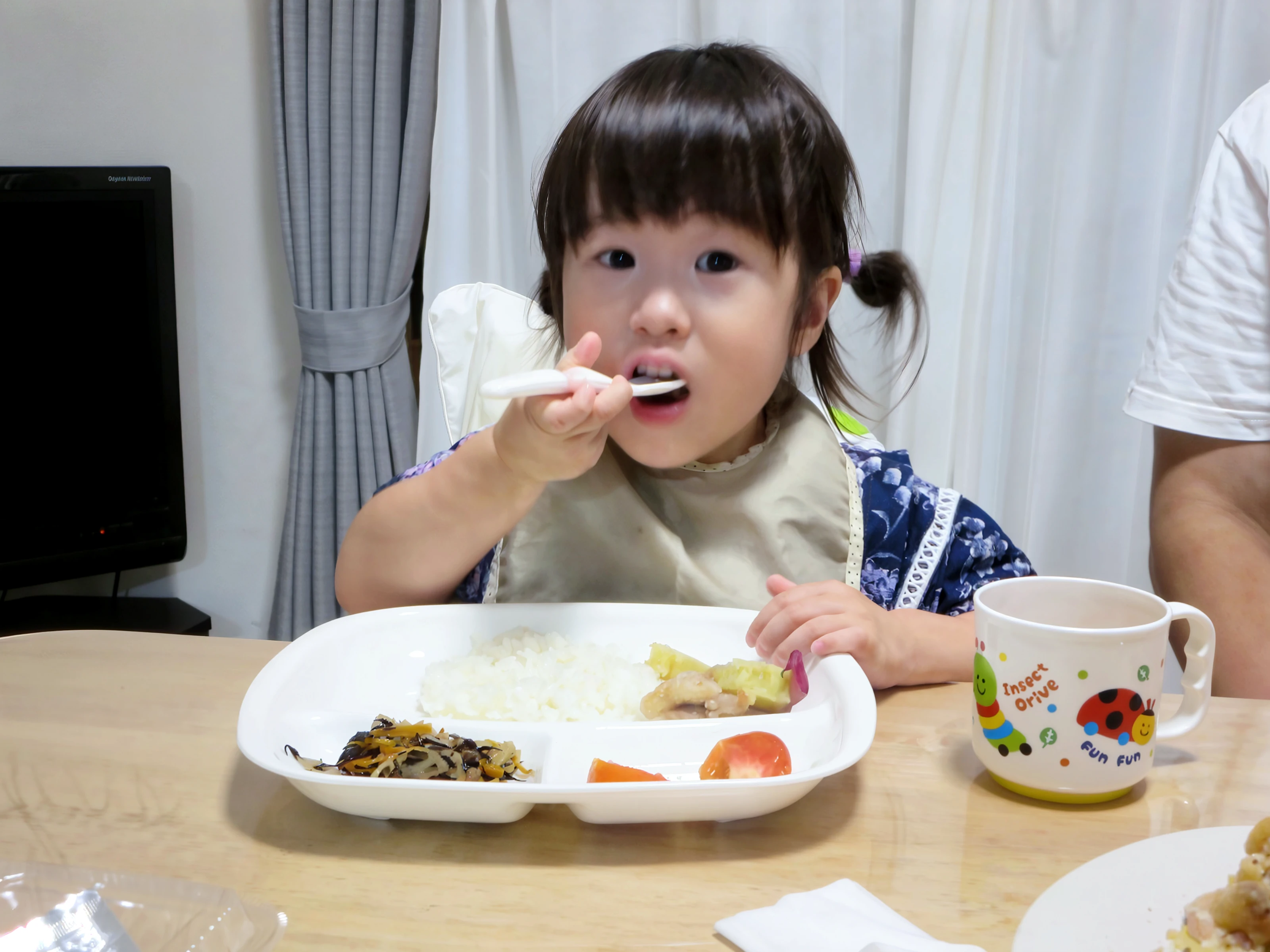 there is a sitting at a table with a plate of food, eating cakes, 2 years oldan girl, little kid, kid, lulu chen, toddler, having a snack, yanjun chengt, good morning, kids, eating, photo taken with nikon d750, photo taken with nikon d 7 5 0, exclusive