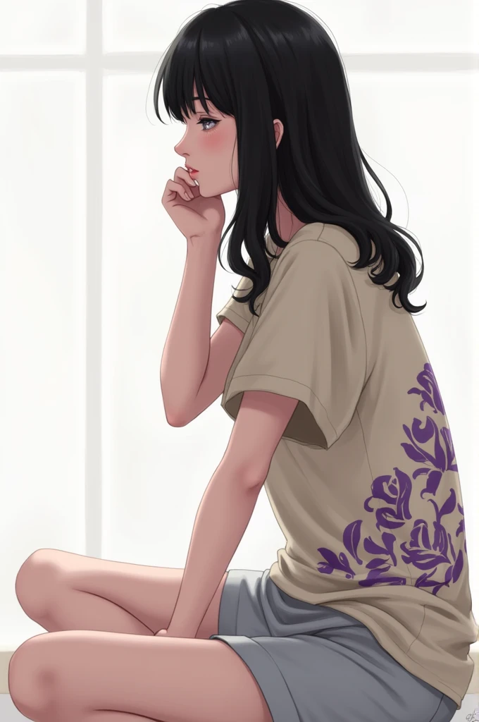 Black-haired woman seen in profile sitting wearing light grey shorts and a beige t-shirt with purple prints.