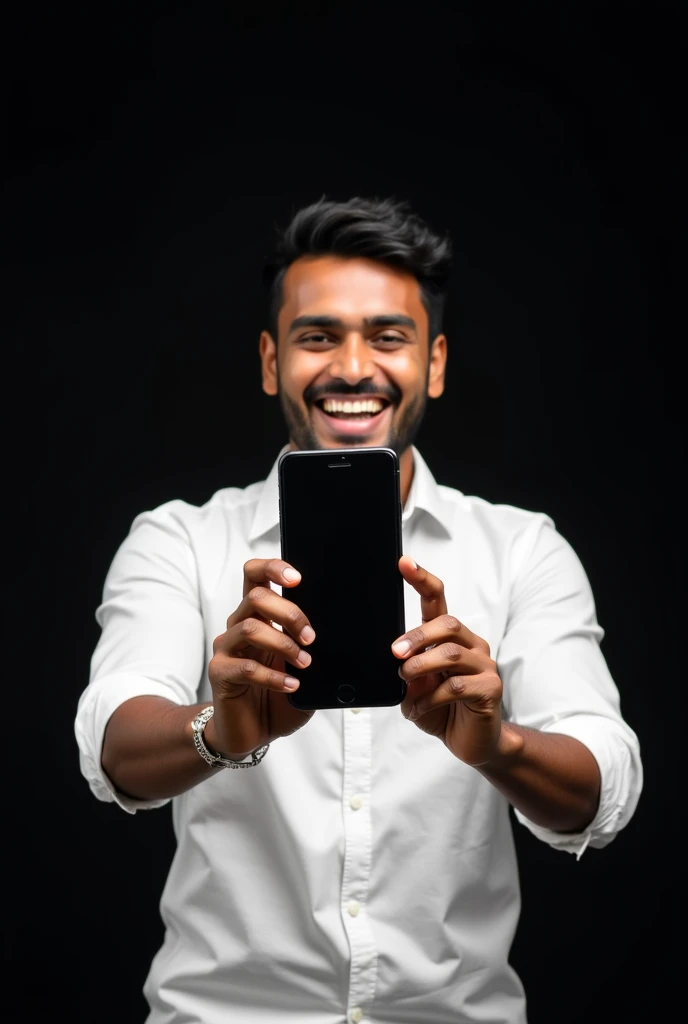 The image shows a young Indian man with hair, smiling and holding up a smartphone and screen of phone is ahead of camera in large image. He is wearing a white full shirt full sleeves and appears to be happy and excited. The background is black