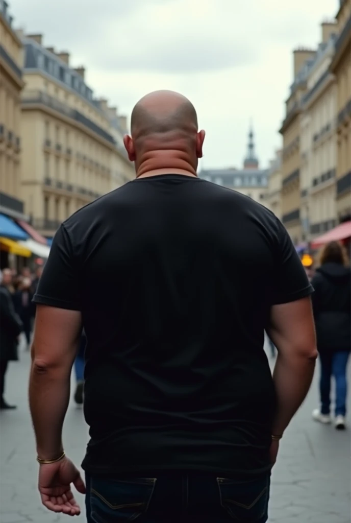 create a realistic photo of a bald man in Paris. he is completely turned away, you can&#39;t see his face, he slightly fat with his back to the camera, wearing a chic basic black t-shirt