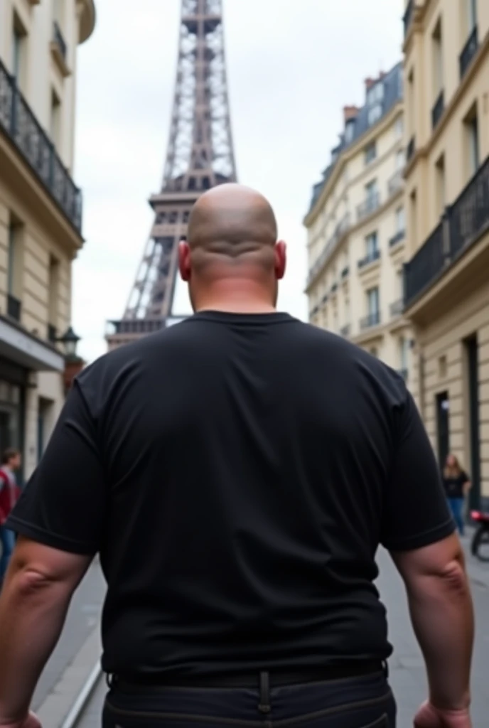 create a realistic photo of a bald man in Paris. showing the Eiffel Tower, he is completely turned away, you can't see his face, of costs for a camera, wearing a chic basic black t-shirt. he is weighing 10 kg more than his weight