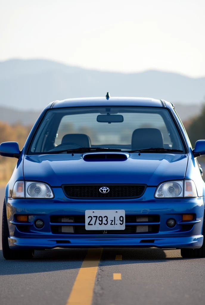 A 1999 toyota starlet glanza V with airflow in the color bleu and plate number ( 2793 ZL 99 ) on the road