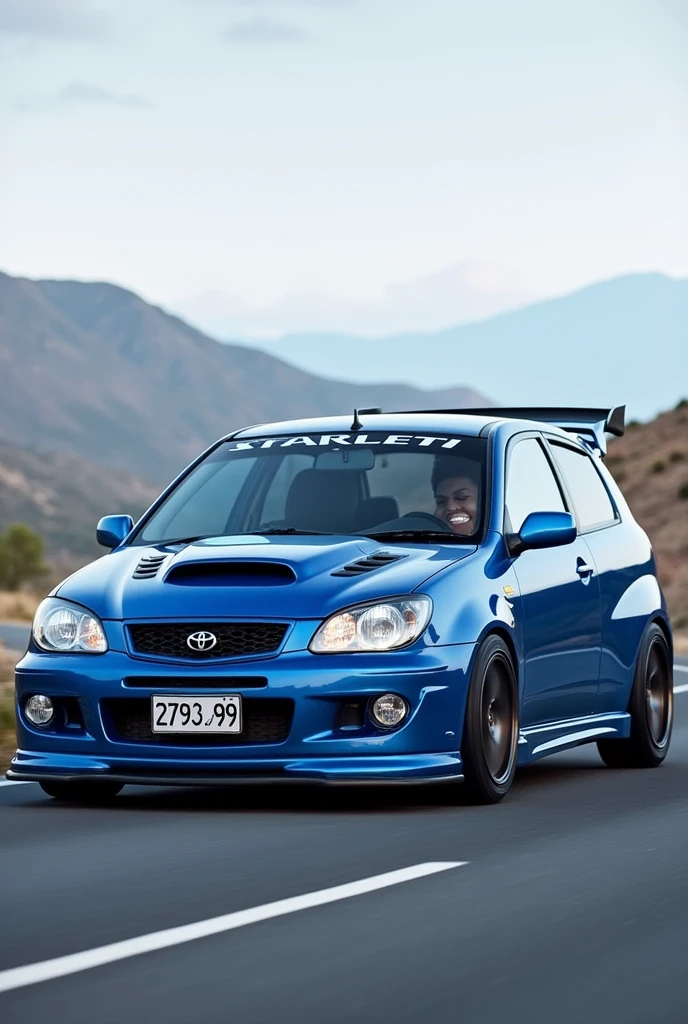 A 1999 toyota starlet glanza V with airflow in the color bleu and plate number ( 2793 ZL 99 ) on the road