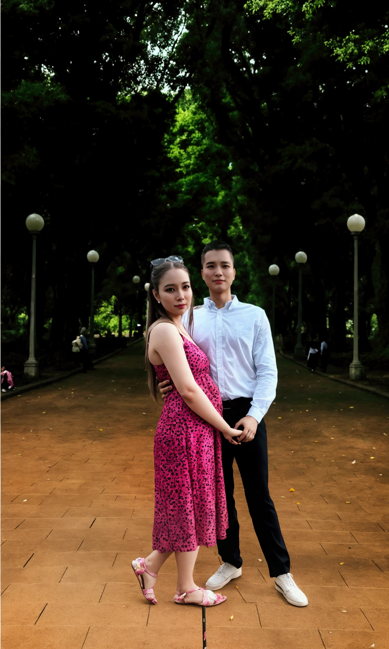 A beautiful couple is standing in the park, a couple is walking in the park