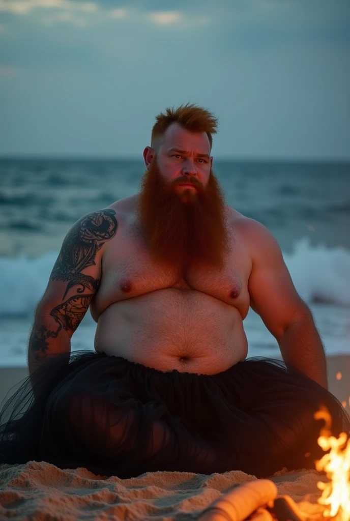 strong fat red-haired bearded man sitting on the sand looking at the sea. he wears gables a black tulle skirt photo with the bonfire lighting appearing. illuminating the body he