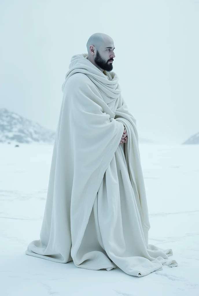 30 year old bald man,moderately solid body, He has a goatee style beard outlined in black. It is extremely pale, He has a serene face and expressive eyes.. Wearing a white blanket, on a white background that causes cold. Your surroundings are frozen, clear, realist. is alone.