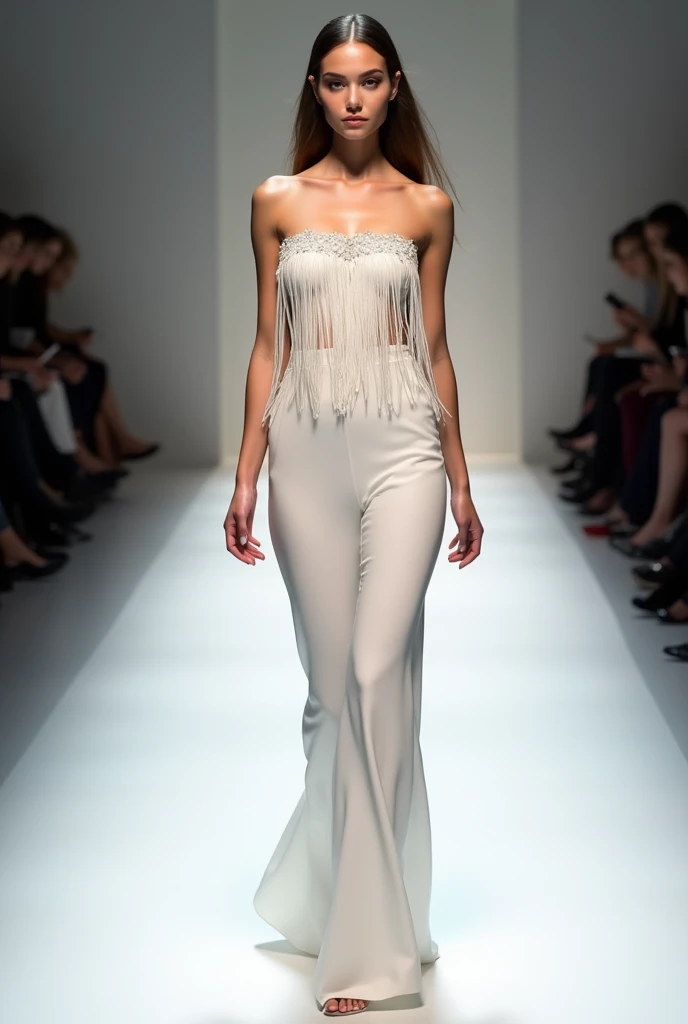 female model on the catwalk wearing a white fringed cross-chest dress 