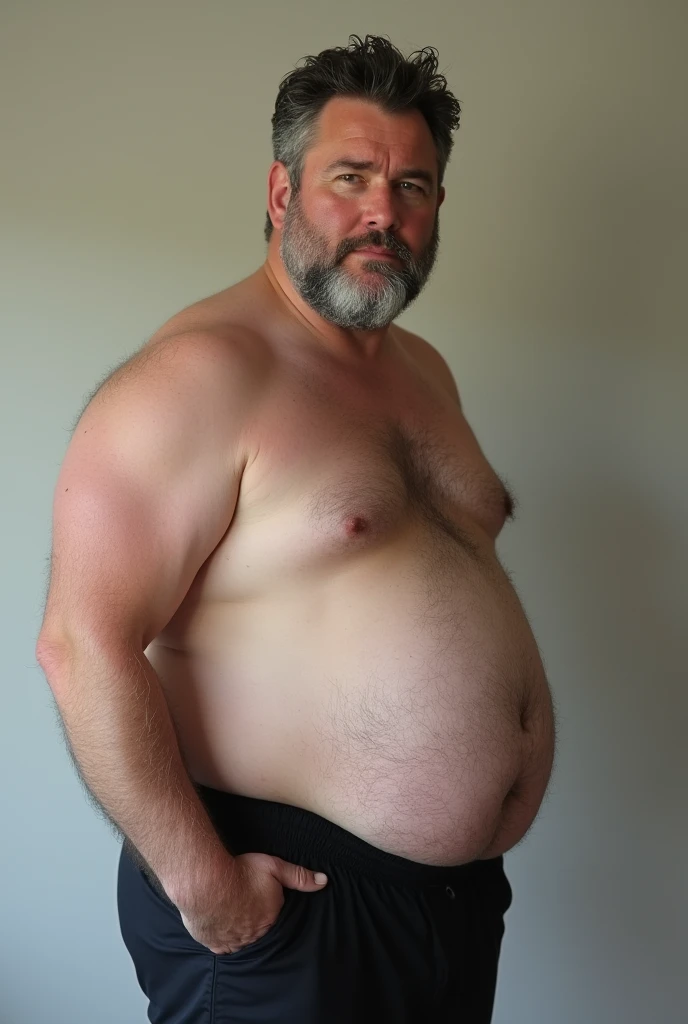 Russell Crowe 30 years old fat with protruding belly, shirtless side view, black boxer ceca, hand in underwear feeling the penis volume inside the underwear