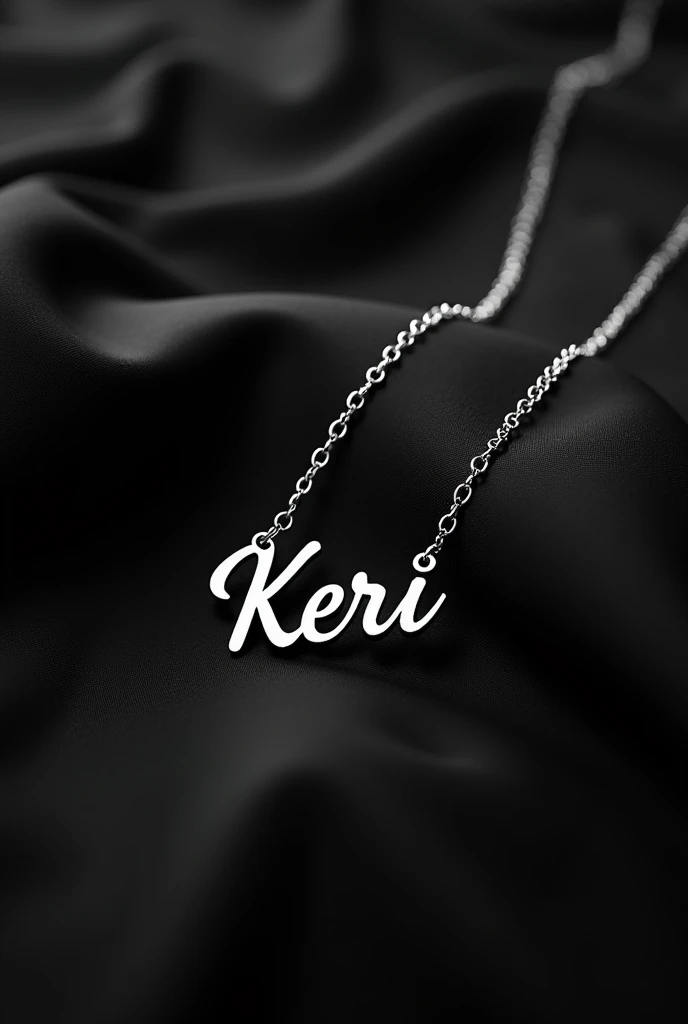 a silver necklace that says the name kerii in a cursive font