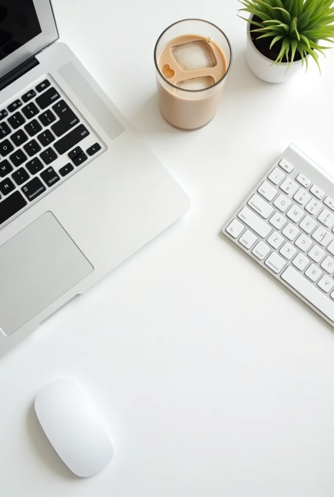 On a programmer&#39;s white desk, all devices are white in color, with iced coffee
