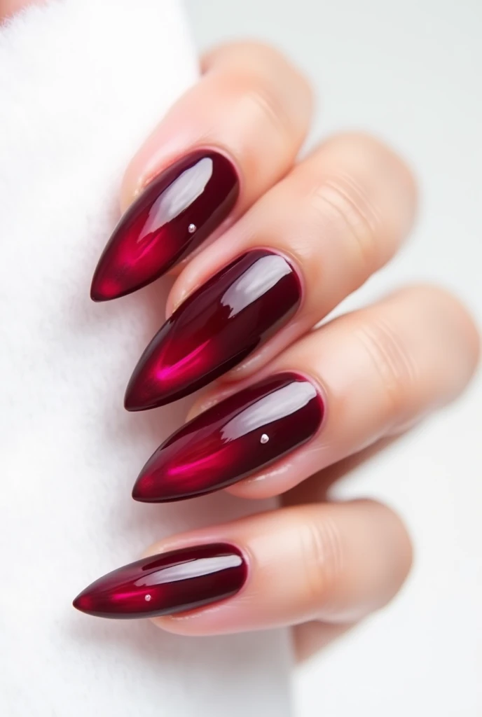 Create an almond-shaped wine-colored ruby nail design on a white background。