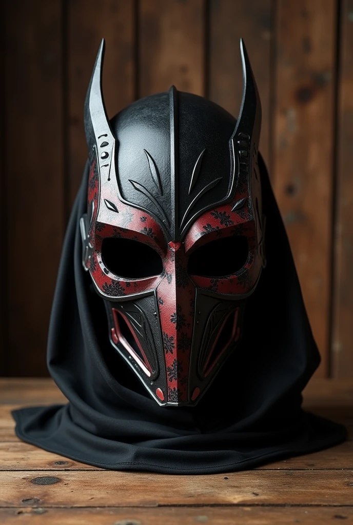 black mask, red and silver full face covering on a wooden table