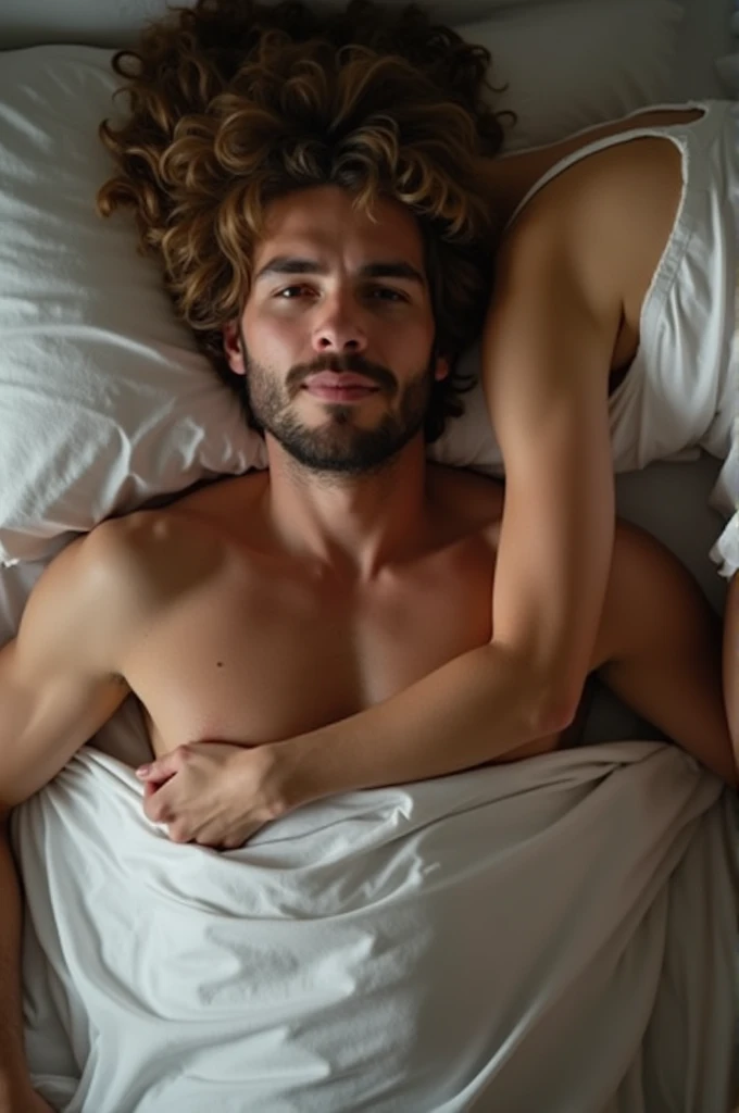Man lying in bed with a woman on top of him