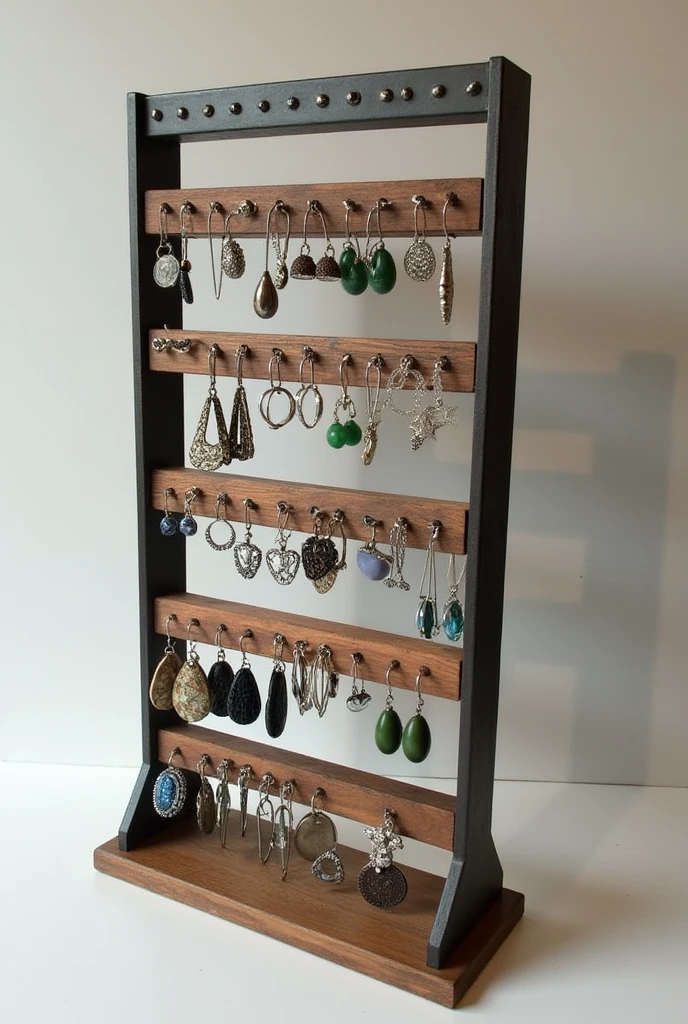You can create a four-tiered wood and iron jewelry display for earrings with samples and an additional bracelet holder and an industrial touch with light embellishments.