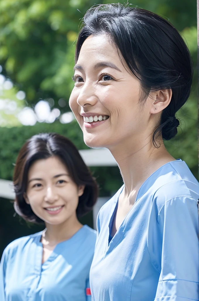 Medical office staff, two women, smiling, wearing light blue clothes, short sleeves, Japanese, black hair, 50s Upper body close-up front Shooting outside looking at the camera Harmony々 Hair tied up