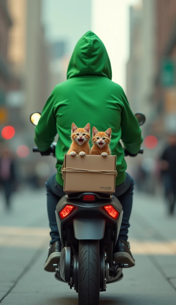A person wearing a green hoodie riding a scooter and having three red kittens in a box which is bound on the back of the scooter, the kittens are crying