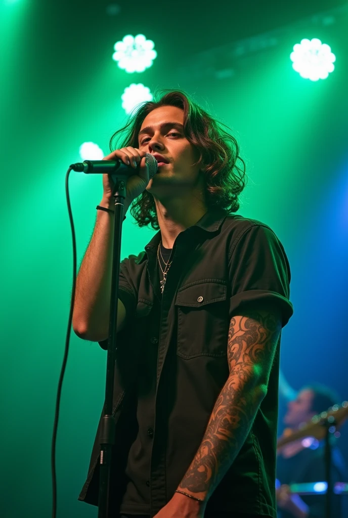 Young man 2, beautiful stylish brown hair. very beautiful, folk style. clear eyes, urban clothing, with tattoos appearing on the arm. on a stage with green and blue lights, singing into a microphone for his excited fans. She is definitely thin. Photo close to him