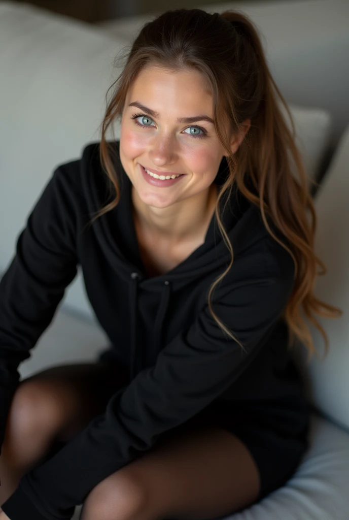 dark brown hair、pulled back ponytail、teaing smile、 she wears a black hoodie.、black pantyhose、adult german woman、blue eyes、showing her black pantyhose、sitting on a couch、young german woman、 she has ocean blue eyes.、