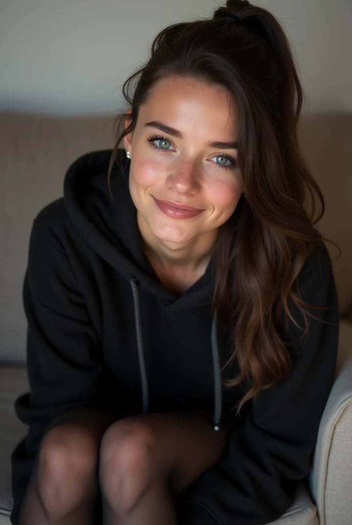dark brown hair、pulled back ponytail、teaing smile、 she wears a black hoodie.、black pantyhose、adult german woman、blue eyes、showing her black pantyhose、lying on a couch、young german woman、wide angle、 she has ocean blue eyes.、