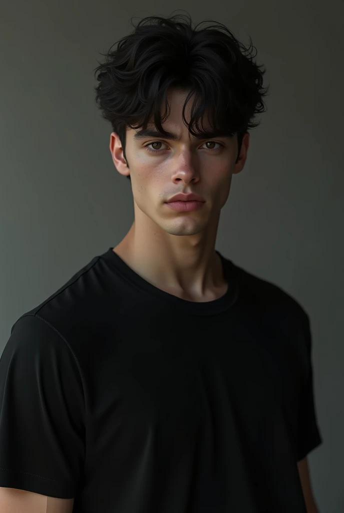 Handsome boy with dark hair and wearing a black t-shirt