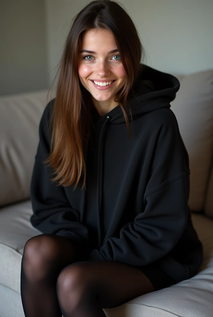 dark brown hair、straight hair、full body 、teaing smile、 she wears a black hoodie.、black pantyhose、adult german woman、blue eyes 、leaning on a couch、showing her legs and feet、young german woman、wide angle、 she has blue eyes.、
