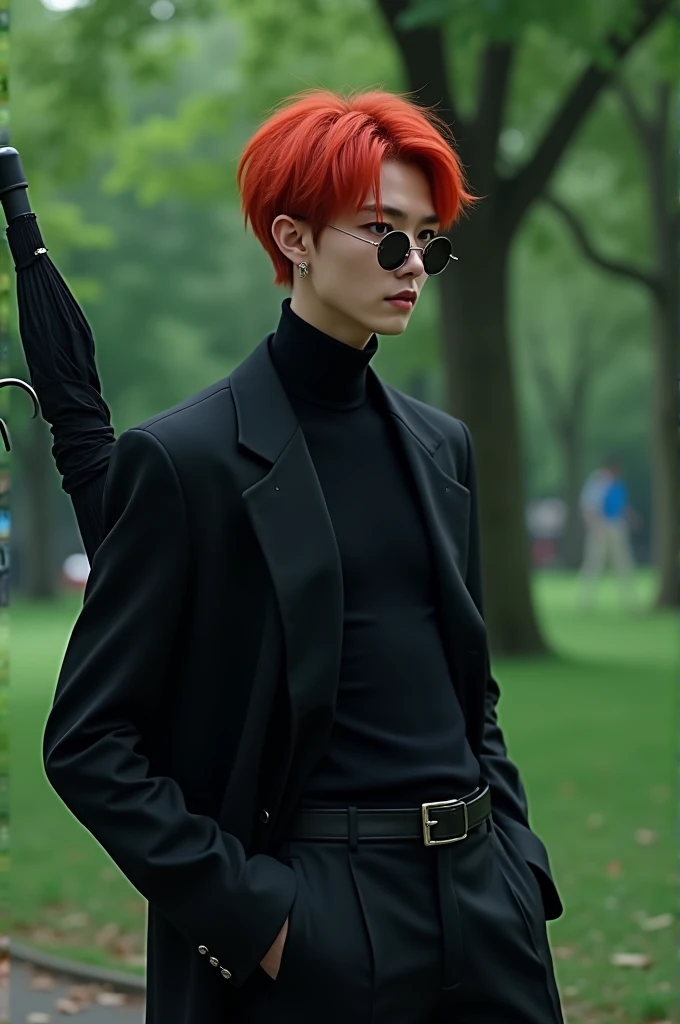 Ateez's San with red hair and blue eyes, dressed all in black with glasses and an umbrella, taking a leisurely stroll through a park.