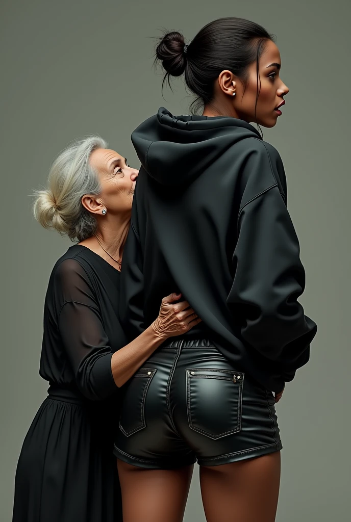 black woman hair in a bun black hoodie black leather short shorts rea;;y in shock as a old grandma in a dress on her knees kissing her ass behind her hand is in her ass holding her ass
