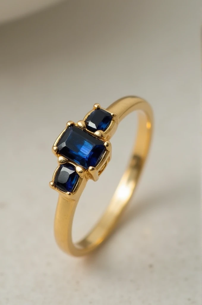a minimal and delicate golden ring with onyx and sapphire