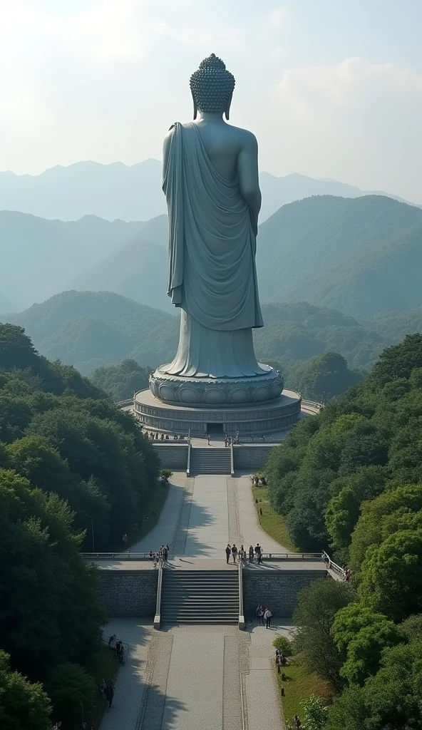 a huge Buddha Statue is standing and looking down in Ushiku, japan, from behind, from above, buddhist temple,