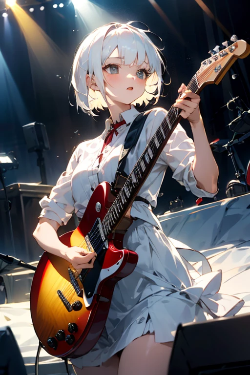 Beautiful girl with short white hair playing a red guitar on stage
