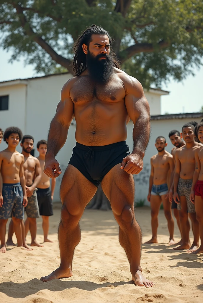 Big hairy, bearded, strong and muscular Brazilian cafuzo teacher standing in just black underwear, teaching how to fight on a sandy terrain with white walls and a large tree in the background. Boys around watching.