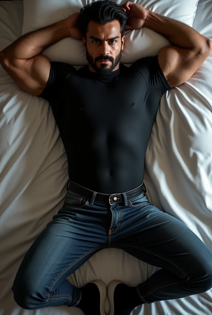 Top view of full body image of Handsome hot very muscular light bearded muslim pathan gym hunk stud wearing tight black compression suit and tight black shirt and black jeans and black sports shoes with black socks is lying on bed