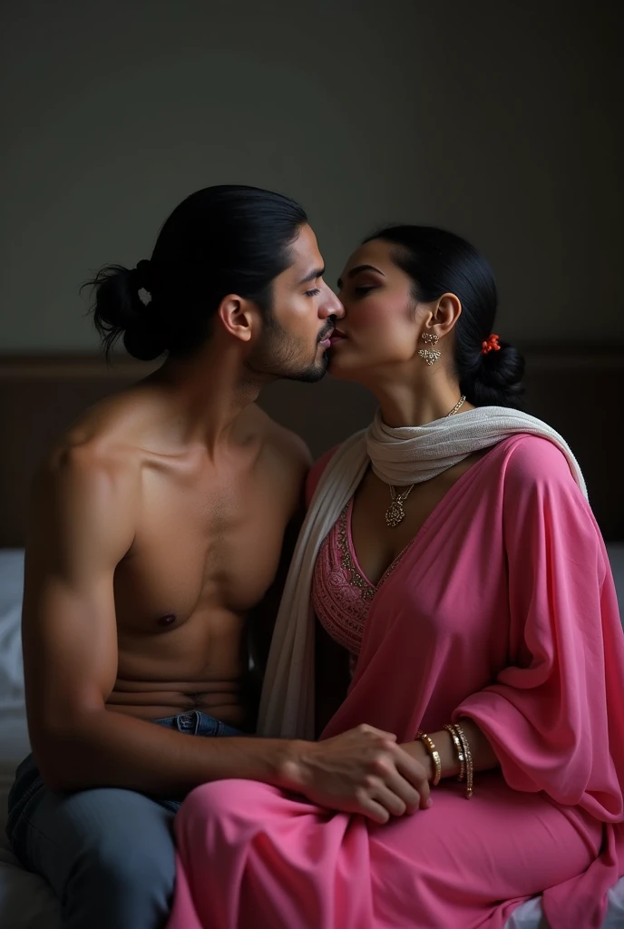 photo of Beautiful Indian Mature Old Aunty, Dark Skin, Wearing Tight pink Kurti with White stole tied around her neck, Showing Large U Cut Cleavage, Hair tied around her back, Sitting on Bed and Kissing a Boy Man, Dim light in the room.